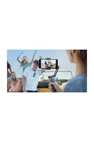 A group of friends being filmed with a smartphone gimbal