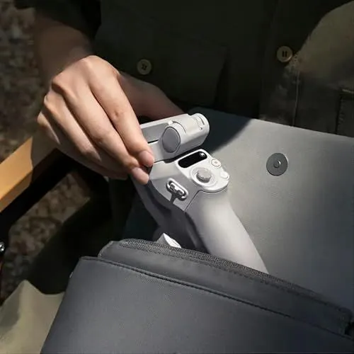 A handheld gimbal being placed into a bag
