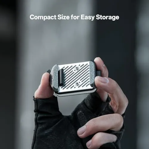 Compact Camera Accessory Held Between Fingers