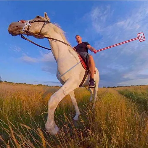 Man Riding a White Horse in a Field