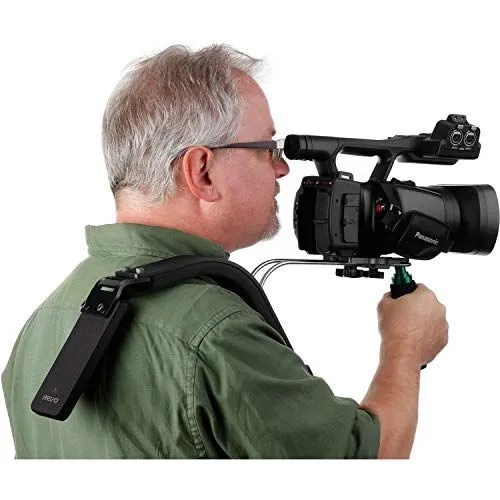 Man using a shoulder rig for a professional video camera