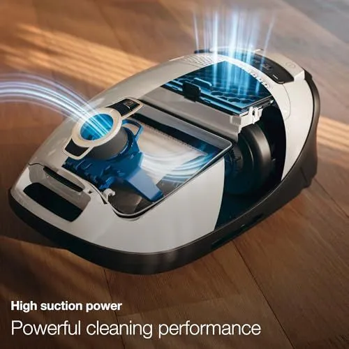 Modern canister vacuum cleaner showcasing internal filtration system