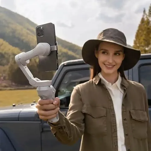 Woman holding a smartphone gimbal stabilizer