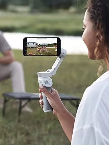 Woman holding a smartphone gimbal stabilizer